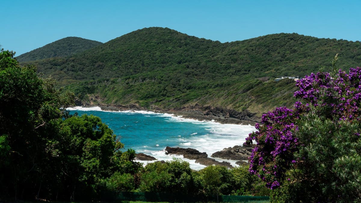 Coastal headland and turquoise bay on Gathang Country